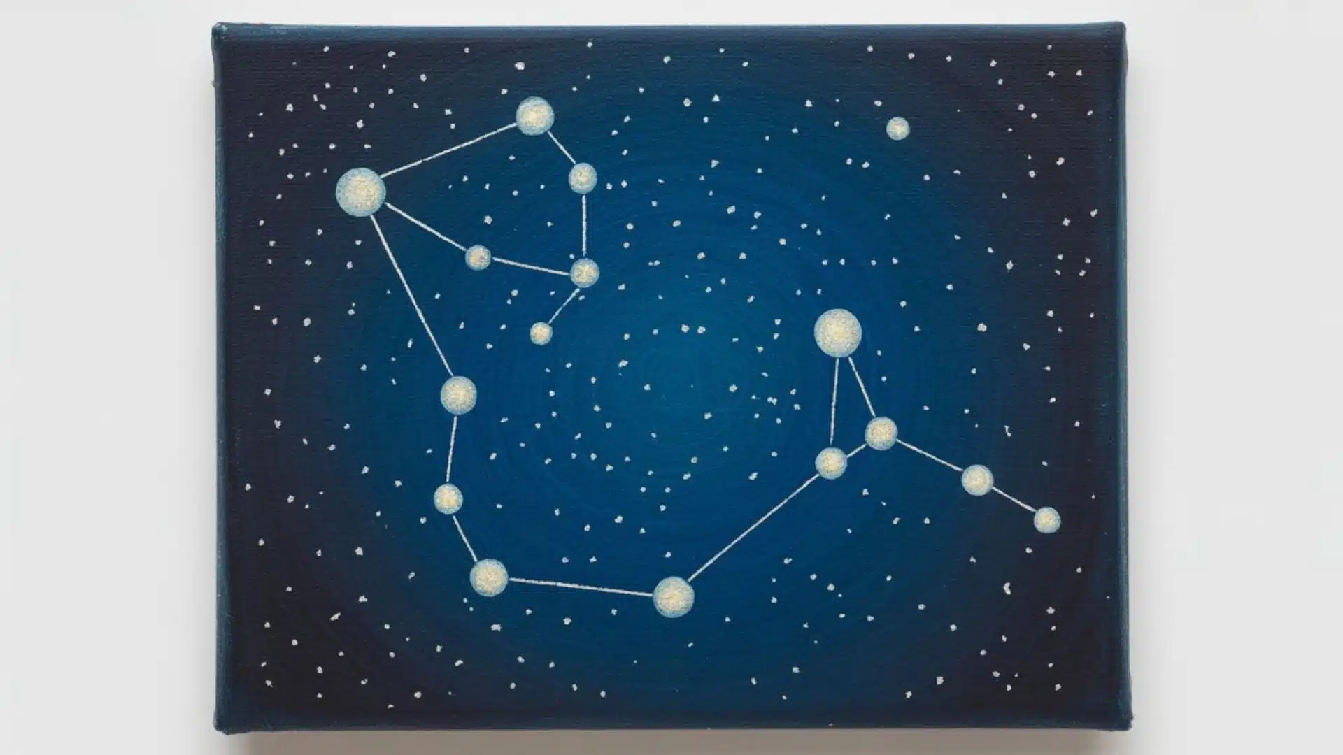 Constellation art featuring star patterns connected by lines against a dark blue sky