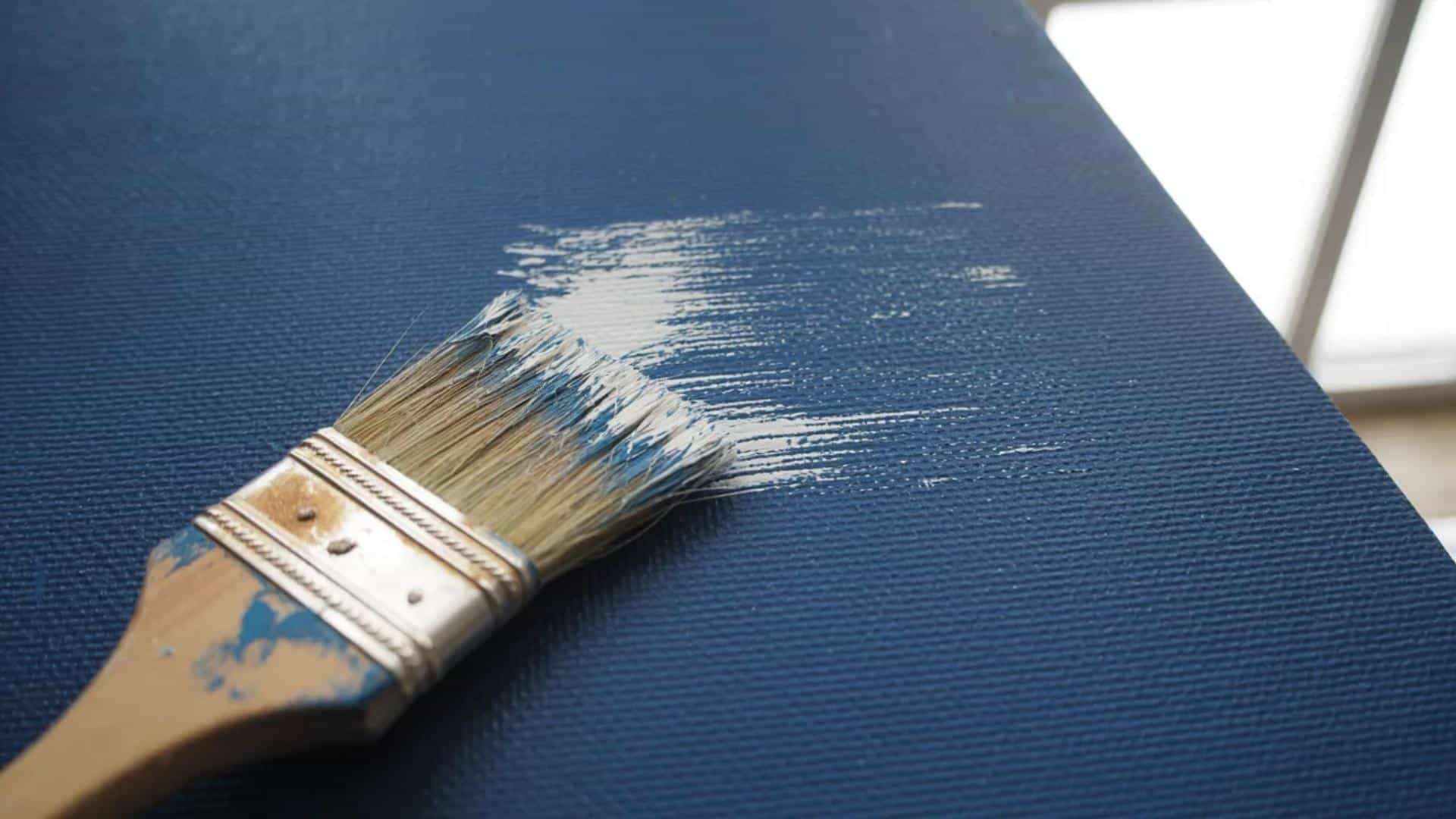 Dry-brushing technique with a brush on a painted surface.